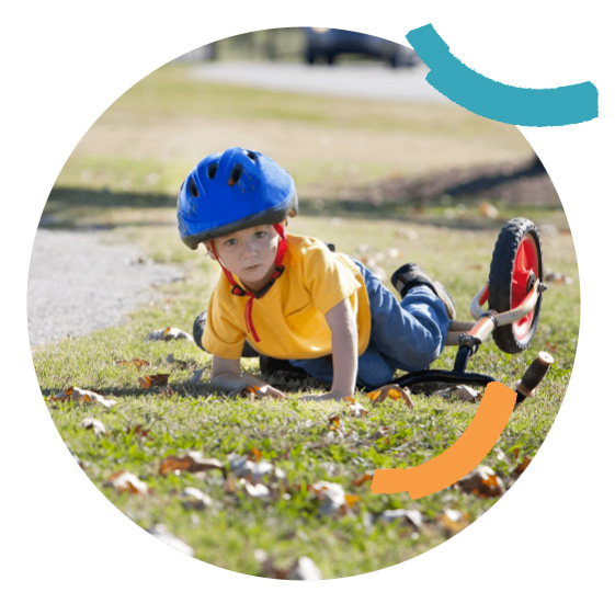 Young boy has just fallen off bike